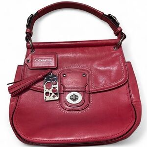 Coach Willis bag, a structured top-handle bag with a turnlock